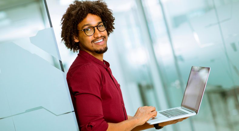 Can You Teach With a Postgraduate Diploma in Education? male student working on laptop